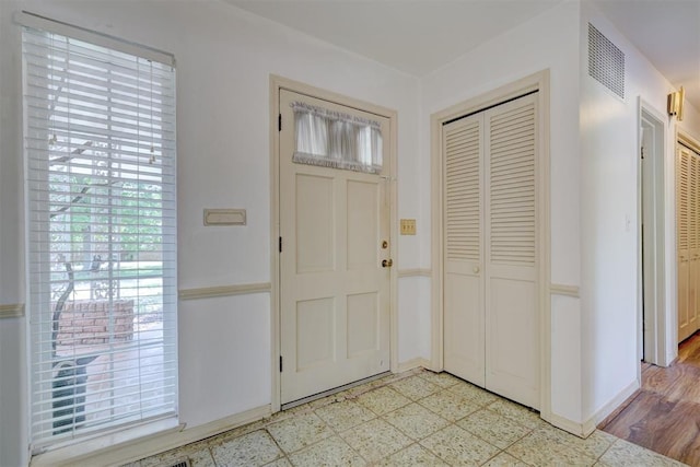 foyer entrance featuring light hardwood / wood-style floors