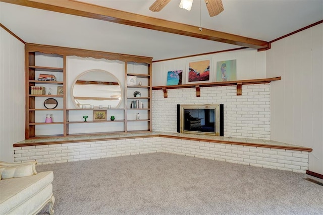 unfurnished living room featuring beam ceiling, crown molding, carpet floors, and wood walls