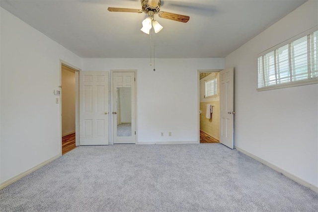 carpeted empty room with ceiling fan