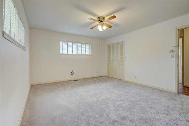 unfurnished room featuring carpet and ceiling fan