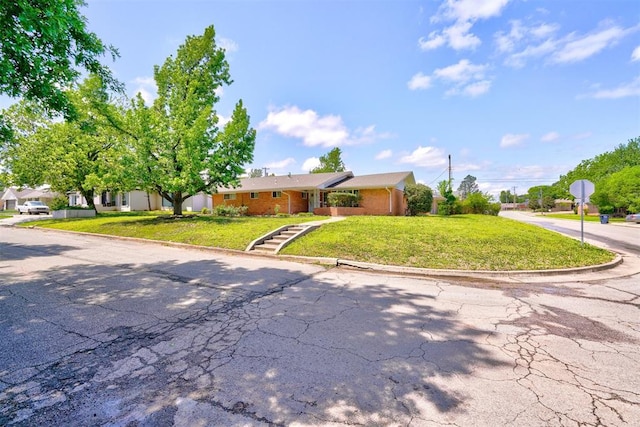 ranch-style house with a front lawn