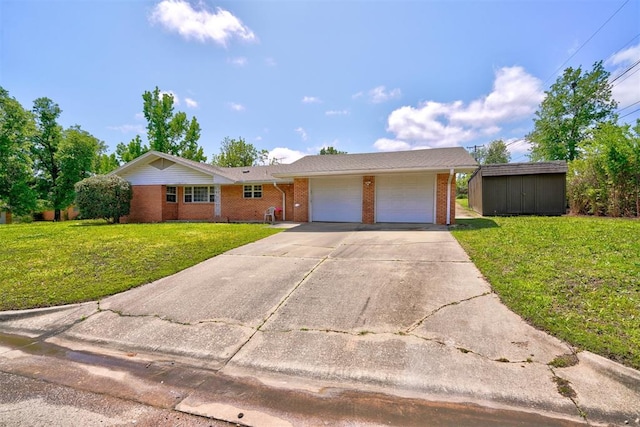 single story home featuring a shed, a front yard, and a garage