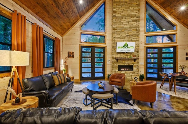 living room with wood walls, wooden ceiling, and french doors