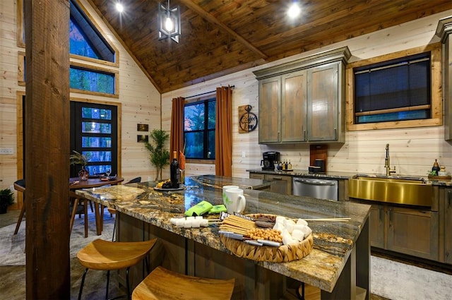 kitchen with dark stone counters, wooden walls, vaulted ceiling, a kitchen island, and a breakfast bar area