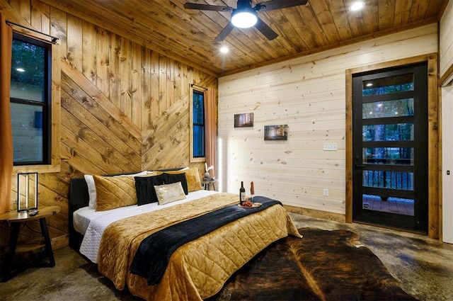 bedroom featuring wooden ceiling and wood walls