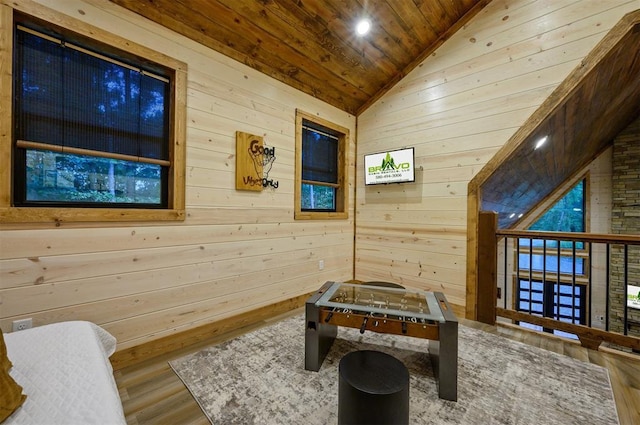 playroom featuring wood ceiling, vaulted ceiling, wood walls, and hardwood / wood-style flooring