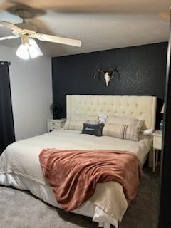 carpeted bedroom featuring ceiling fan