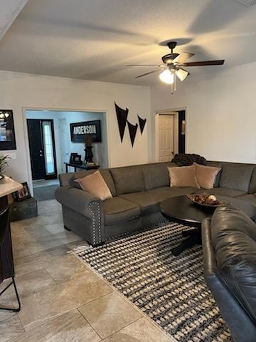 living room featuring ceiling fan