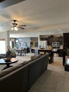 living room featuring ceiling fan