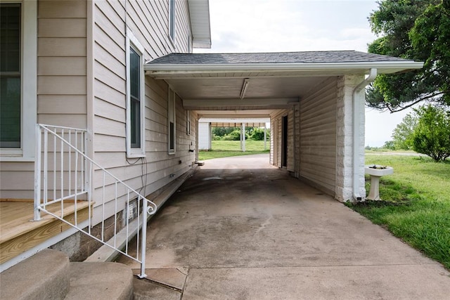 view of home's exterior featuring a yard and a carport