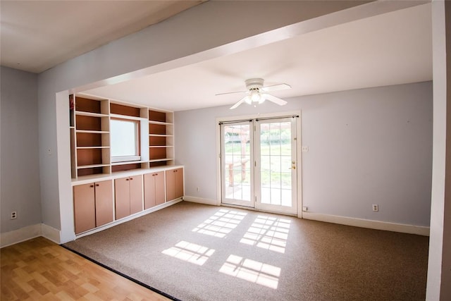 spare room with ceiling fan and light hardwood / wood-style flooring