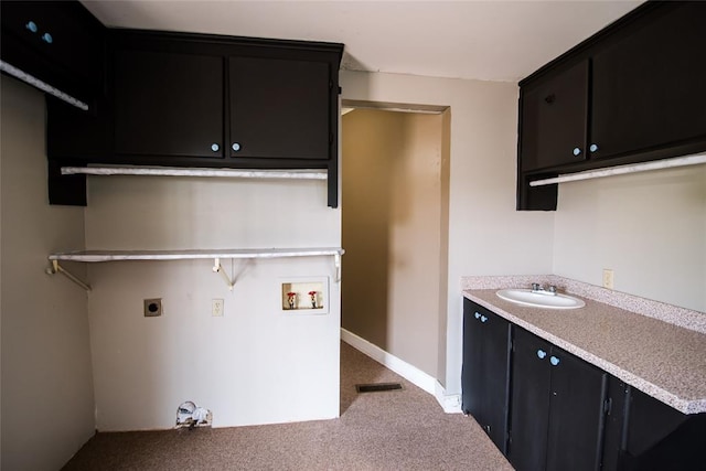 washroom featuring carpet, washer hookup, cabinets, electric dryer hookup, and sink