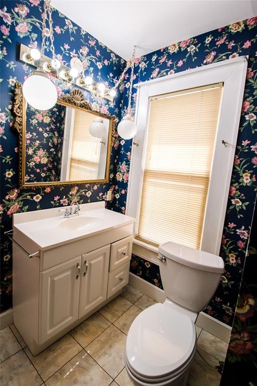 bathroom with tile patterned floors, vanity, and toilet