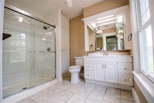 bathroom with tile patterned floors, vanity, toilet, and an enclosed shower