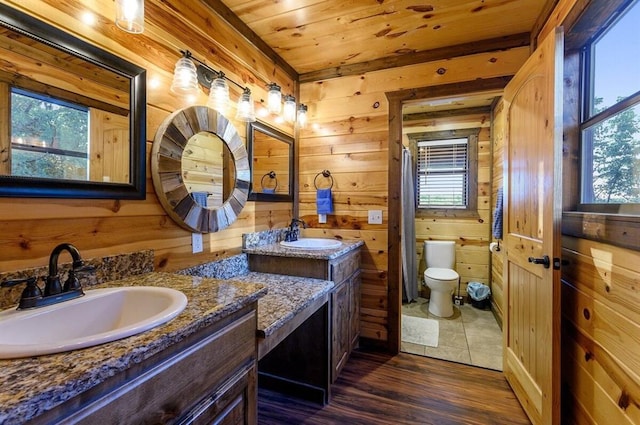 bathroom featuring plenty of natural light, wood-type flooring, wooden walls, and wooden ceiling