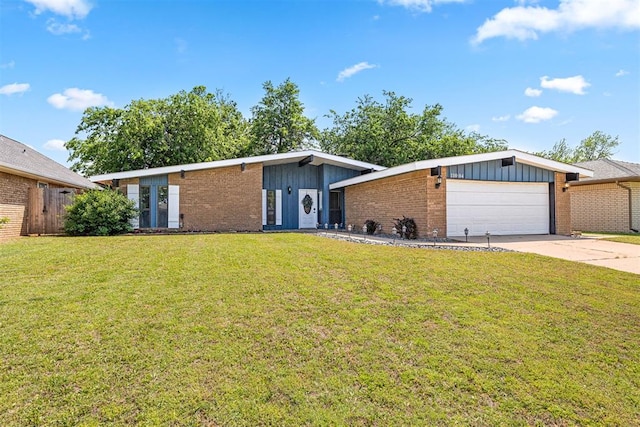 ranch-style house with a garage and a front lawn