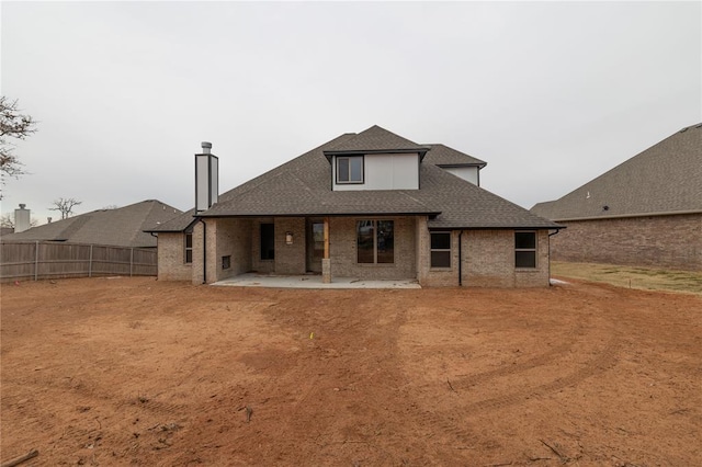 back of property with a patio area