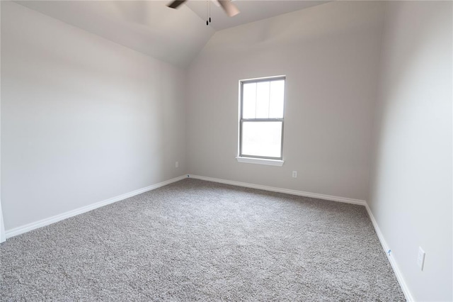 unfurnished room with carpet, vaulted ceiling, and ceiling fan