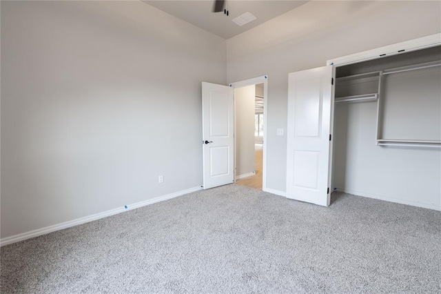 unfurnished bedroom with carpet floors and a closet