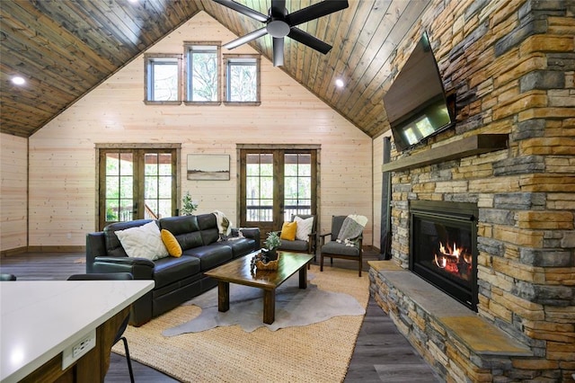 living room featuring wooden walls, french doors, high vaulted ceiling, and wooden ceiling