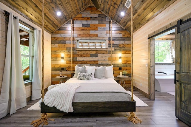 bedroom with lofted ceiling, dark wood-type flooring, and wood walls