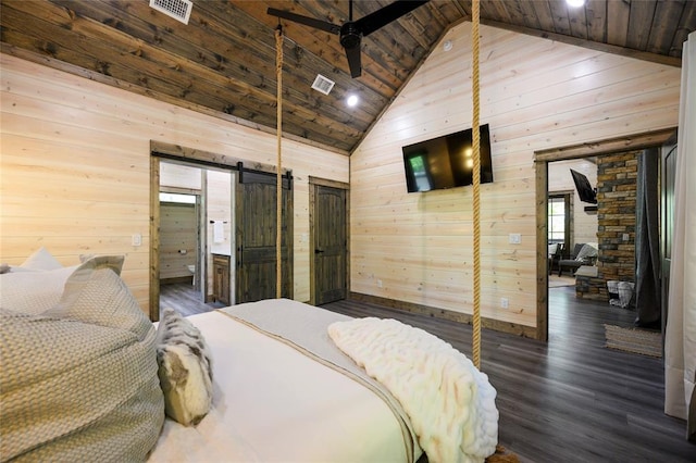 bedroom with wood walls, wooden ceiling, dark wood-type flooring, high vaulted ceiling, and a barn door