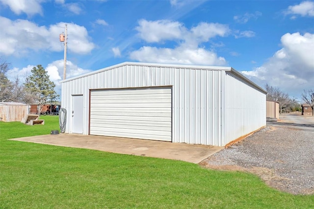 garage featuring a yard