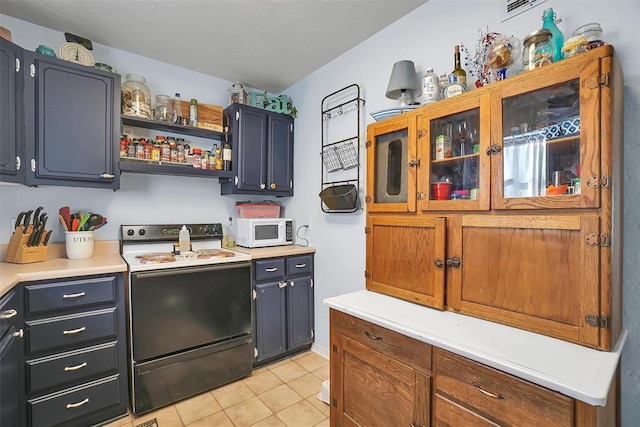 kitchen with light tile patterned floors and white appliances