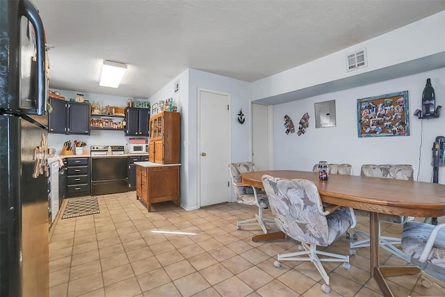 dining room featuring light tile patterned floors