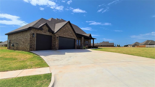 view of front of home featuring a garage and a front lawn