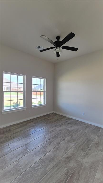 unfurnished room featuring ceiling fan