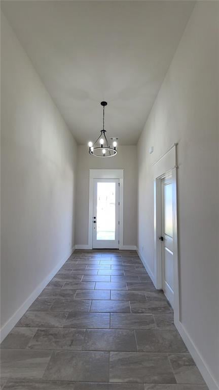 200 Braxton Way, Yukon, OK 73099 - entryway featuring a chandelier and baseboards