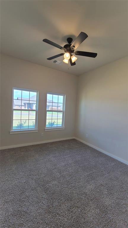 200 Braxton Way, Yukon, OK 73099 - unfurnished room with ceiling fan, carpet flooring, and baseboards
