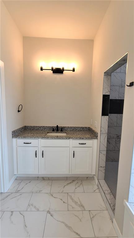 200 Braxton Way, Yukon, OK 73099 - full bath featuring marble finish floors, tiled shower, vanity, and baseboards