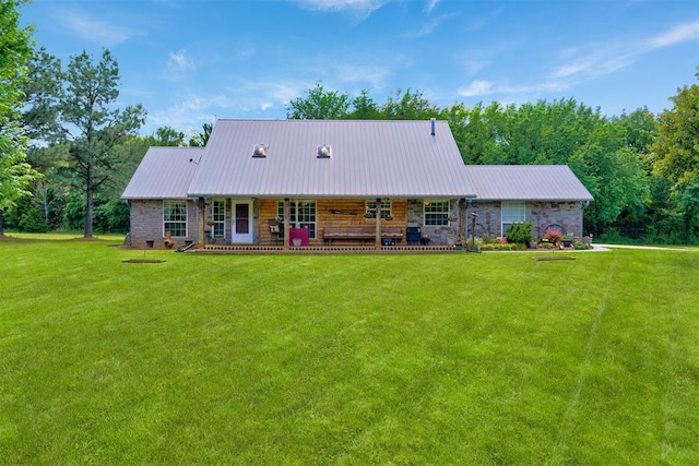 back of house with a yard