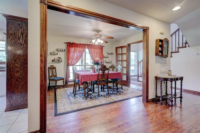 dining area featuring light hardwood / wood-style floors and ceiling fan