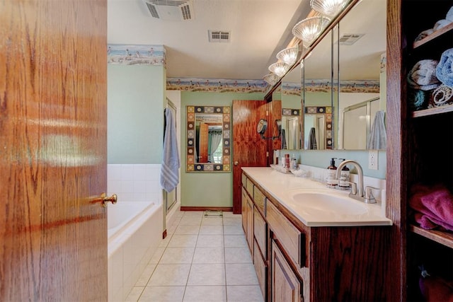 bathroom with tile patterned floors, vanity, and separate shower and tub