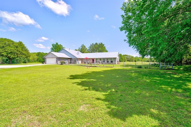 view of front of house with a garage and a front yard