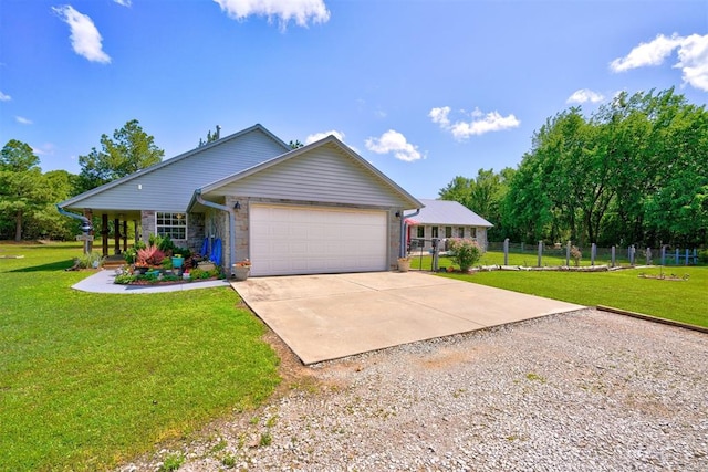 view of front of home featuring a front yard and a garage