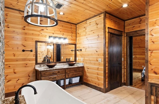 bathroom with hardwood / wood-style floors, wooden ceiling, a tub, and wooden walls