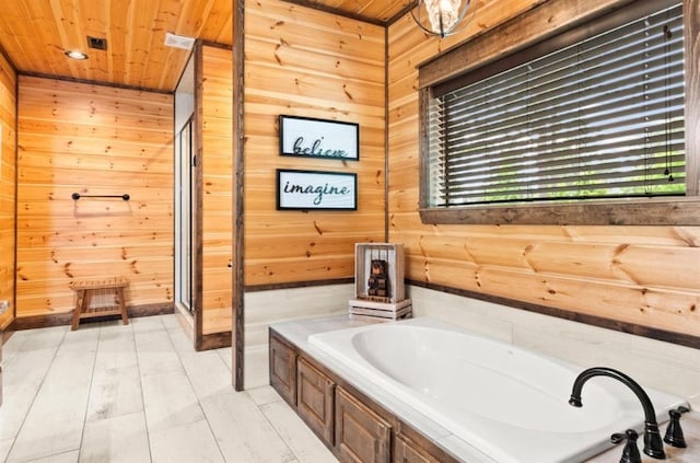 bathroom featuring wood walls, a bathtub, and wood ceiling