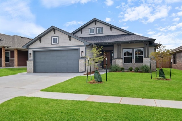 craftsman-style house featuring a garage and a front lawn