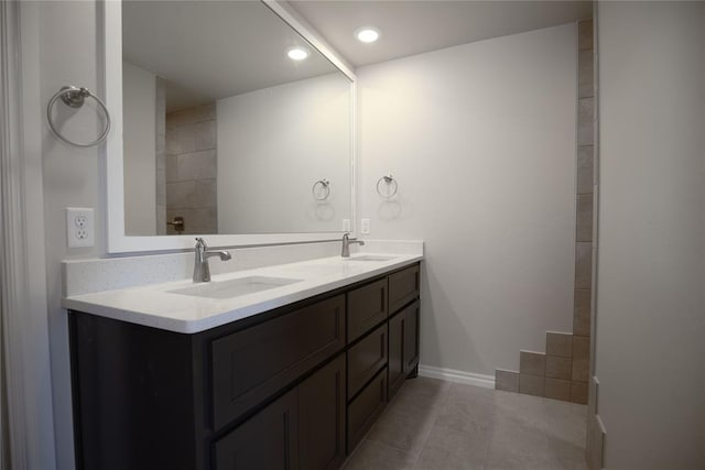 bathroom featuring tile patterned flooring and vanity