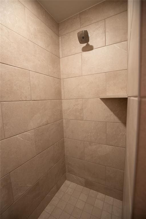 bathroom with tiled shower