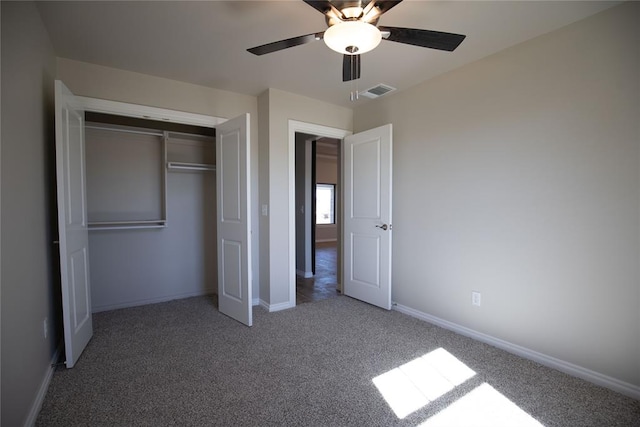 unfurnished bedroom featuring carpet floors, a closet, and ceiling fan