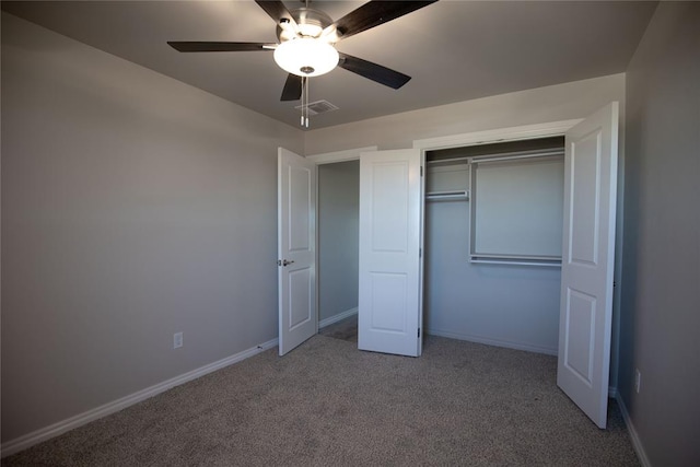 unfurnished bedroom with carpet flooring, ceiling fan, and a closet