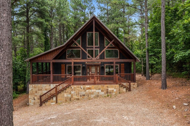 log cabin with a porch