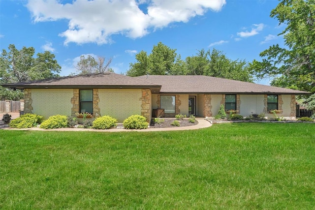 ranch-style home with a front lawn