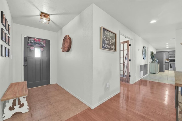 entryway with light hardwood / wood-style floors