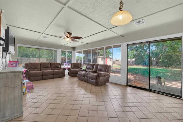 sunroom / solarium with ceiling fan